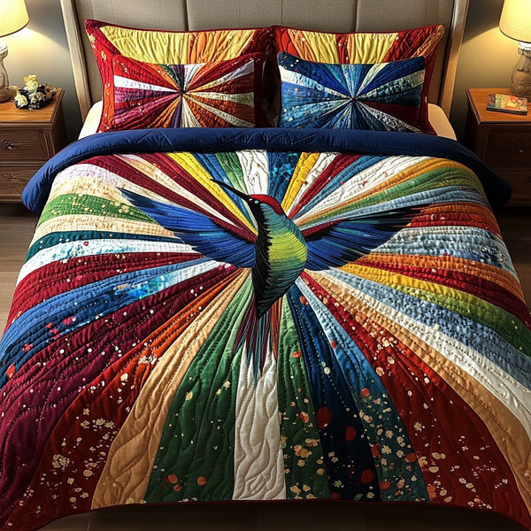 Harmony Bird quilted 3-piece bedding set on a made bed with two matching pillow shams