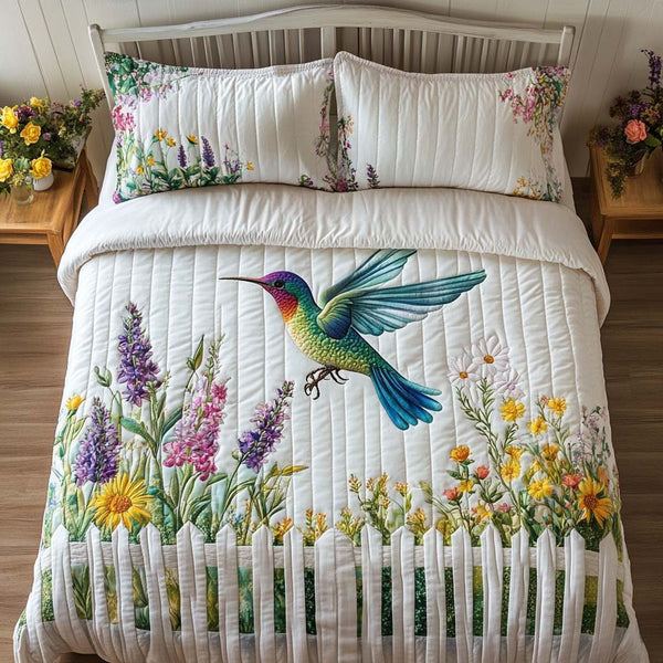 Harmony Bloom quilted 3-piece bedding set on a made bed with two matching pillow shams