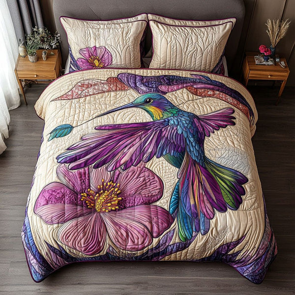 Harmony in Flight quilted 3-piece bedding set on a made bed with two matching pillow shams