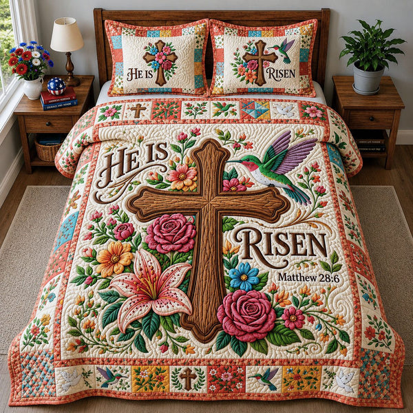 He Is Risen quilted 3-piece bedding set on a made bed with two matching pillow shams