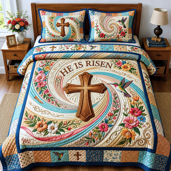 He Is Risen quilted 3-piece bedding set on a made bed with two matching pillow shams