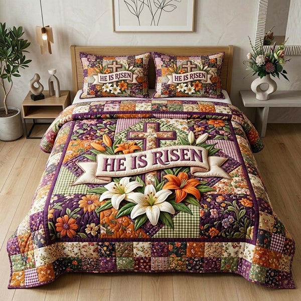 He Risen quilted 3-piece bedding set on a made bed with two matching pillow shams