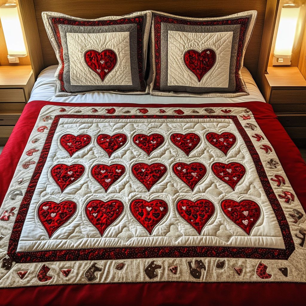Heart Bliss quilted 3-piece bedding set on a made bed with two matching pillow shams