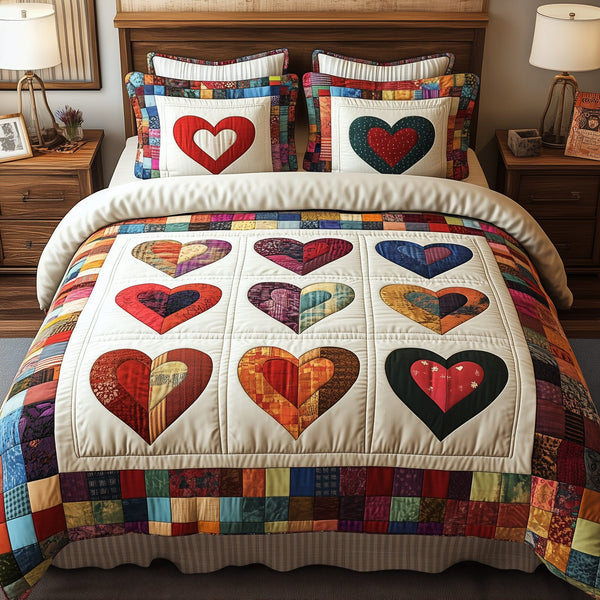 Heart By Heart quilted 3-piece bedding set on a made bed with two matching pillow shams