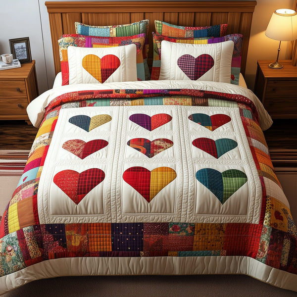 Heart By Heart quilted 3-piece bedding set on a made bed with two matching pillow shams
