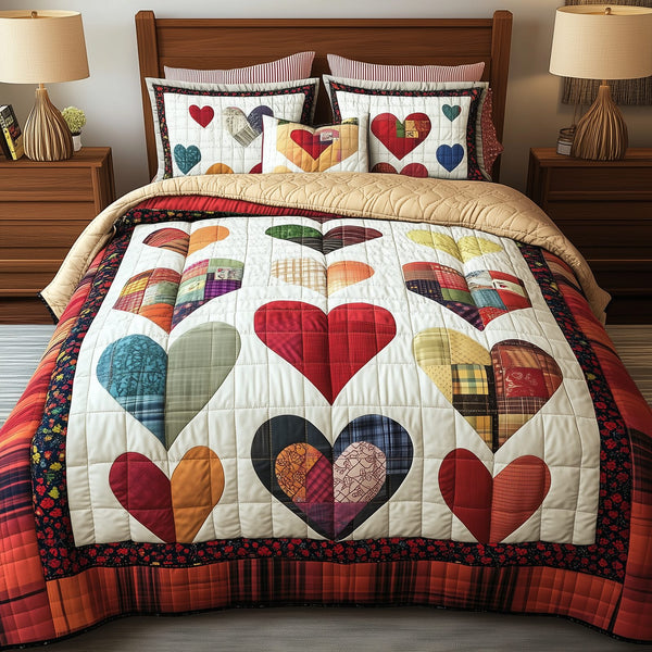 Heart By Heart quilted 3-piece bedding set on a made bed with two matching pillow shams