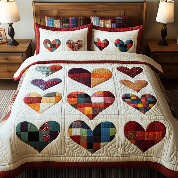 Heart By Heart quilted 3-piece bedding set on a made bed with two matching pillow shams