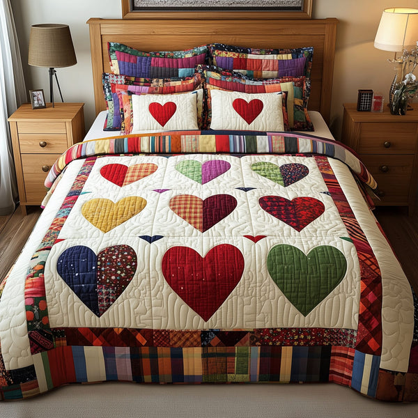 Heart By Heart quilted 3-piece bedding set on a made bed with two matching pillow shams
