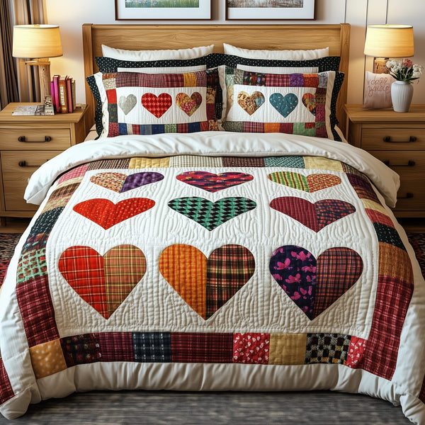 Heart By Heart quilted 3-piece bedding set on a made bed with two matching pillow shams