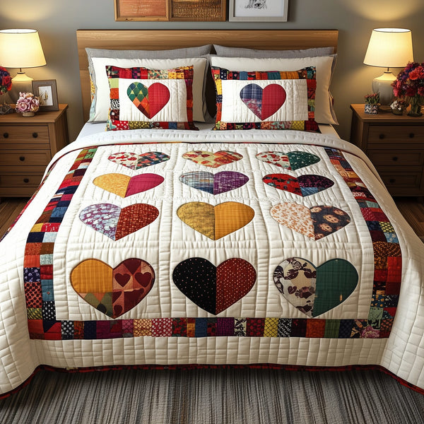 Heart By Heart quilted 3-piece bedding set on a made bed with two matching pillow shams