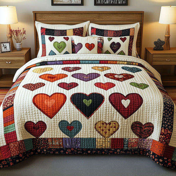 Heart By Heart quilted 3-piece bedding set on a made bed with two matching pillow shams