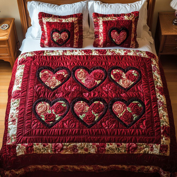 Heart Land quilted 3-piece bedding set on a made bed with two matching pillow shams