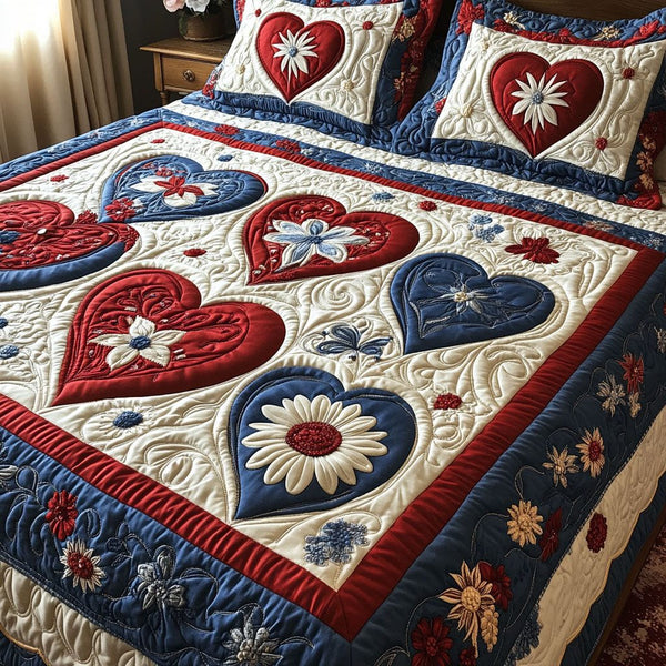 Heart of Freedom quilted 3-piece bedding set on a made bed in a warmly lit bedroom