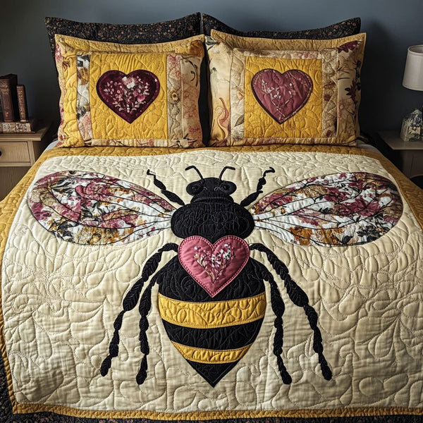 Heart of the Hive quilted 3-piece bedding set on a made bed with two matching pillow shams
