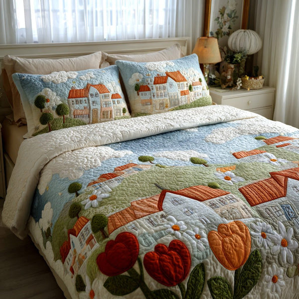 Heart Village quilted 3-piece bedding set on a made bed with two matching pillow shams