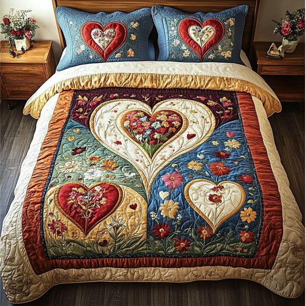 Heartfelt Dreams quilted 3-piece bedding set on a made bed with two matching pillow shams