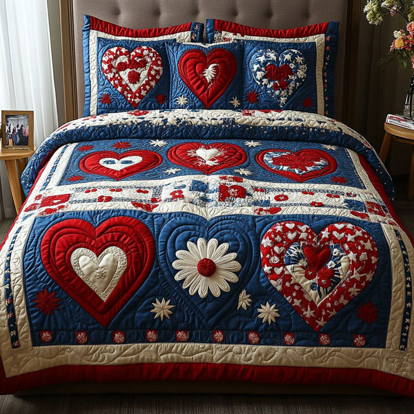 Heartfelt Elegance quilted 3-piece bedding set on a made bed with two matching pillow shams