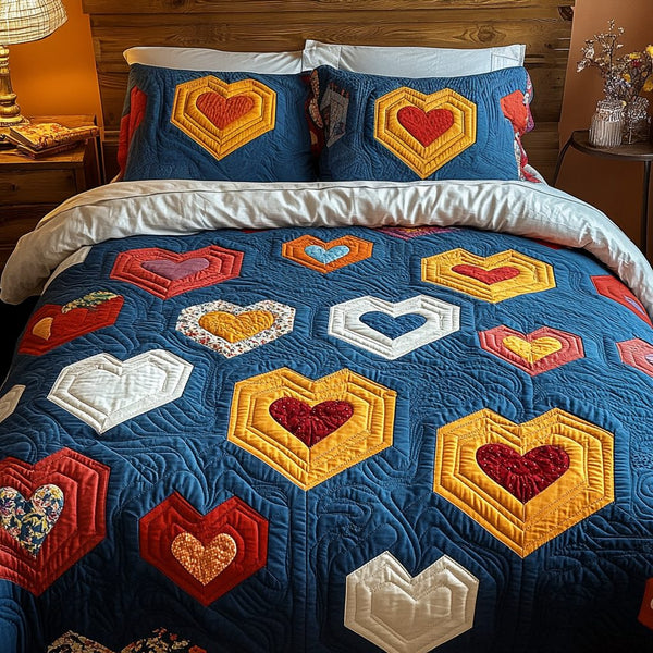 Heartfelt Harmony quilted 3-piece bedding set on a made bed with two matching pillow shams
