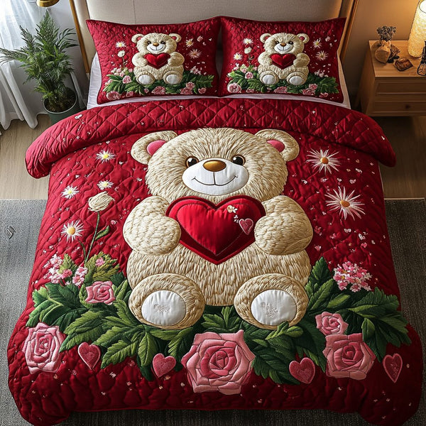 Heartfelt Hugs quilted 3-piece bedding set on a made bed with two matching pillow shams