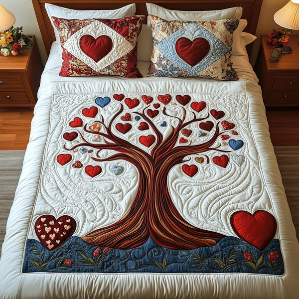 Heartfelt Roots quilted 3-piece bedding set on a made bed with two matching pillow shams