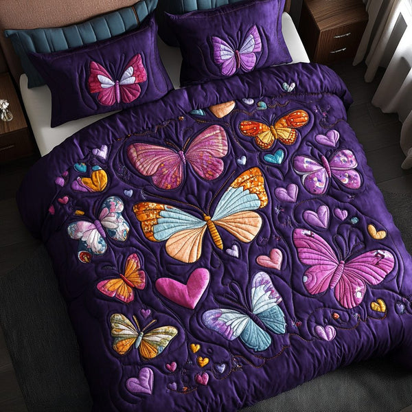 Heartflutter quilted 3-piece bedding set on a made bed with two matching pillow shams