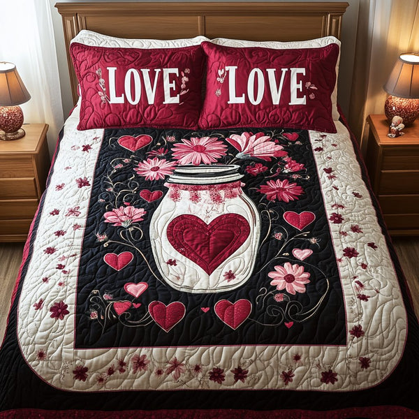Hearts Aflutter quilted 3-piece bedding set on a made bed with two matching pillow shams