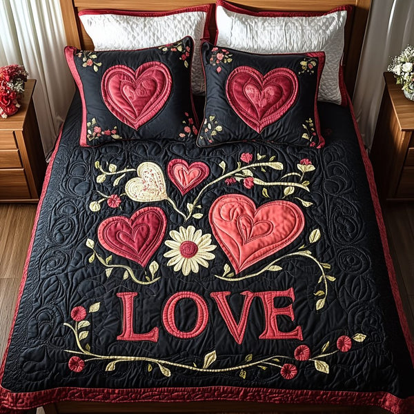 Hearts in Bloom quilted 3-piece bedding set on a made bed with two matching pillow shams