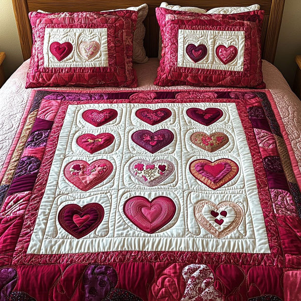 Heartstrings quilted 3-piece bedding set on a made bed with two matching pillow shams