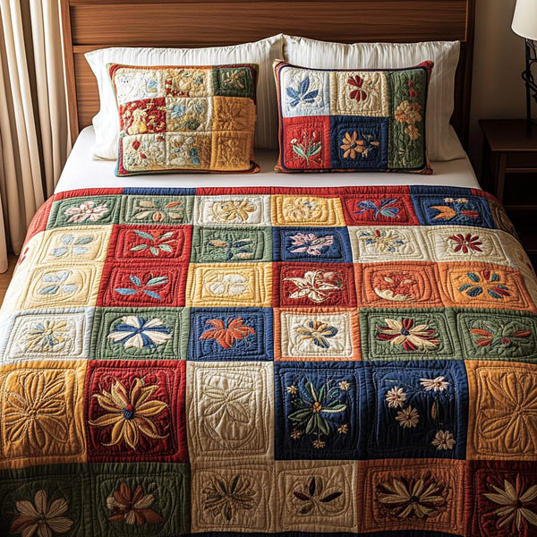 Heirloom Delight quilted 3-piece bedding set on a made bed with two matching pillow shams