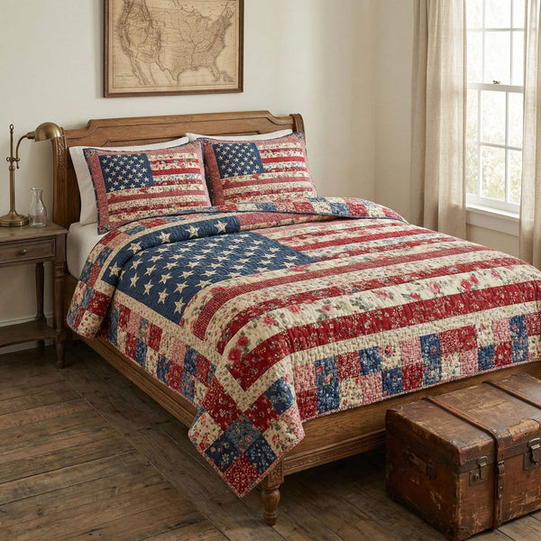 Heritage Patchwork Flag quilted 3-piece bedding set on a made bed in a warmly lit bedroom