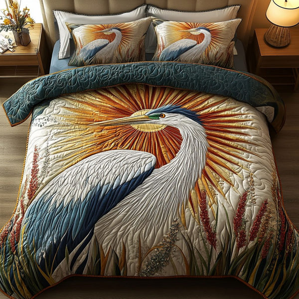 Heron Haven quilted 3-piece bedding set on a made bed with two matching pillow shams