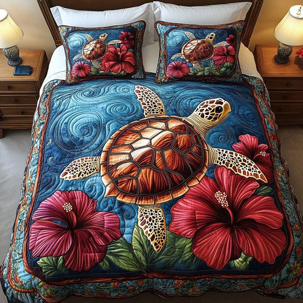 Hibiscus Dream quilted 3-piece bedding set on a made bed with two matching pillow shams