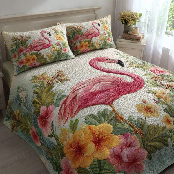 Hibiscus Flamingo quilted 3-piece bedding set on a made bed with two matching pillow shams