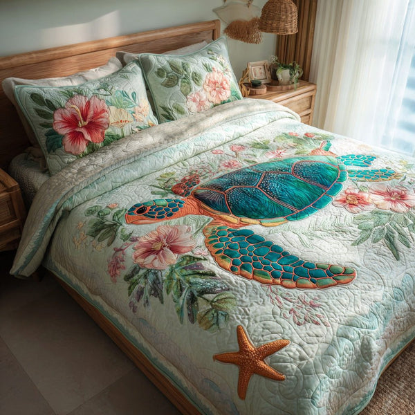 Hibiscus Glide quilted 3-piece bedding set on a made bed with two matching pillow shams
