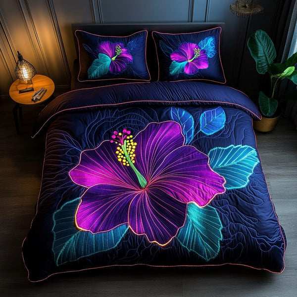 Hibiscus Haven quilted 3-piece bedding set on a made bed with two matching pillow shams