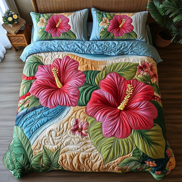 Hibiscus Horizon quilted 3-piece bedding set on a made bed with two matching pillow shams