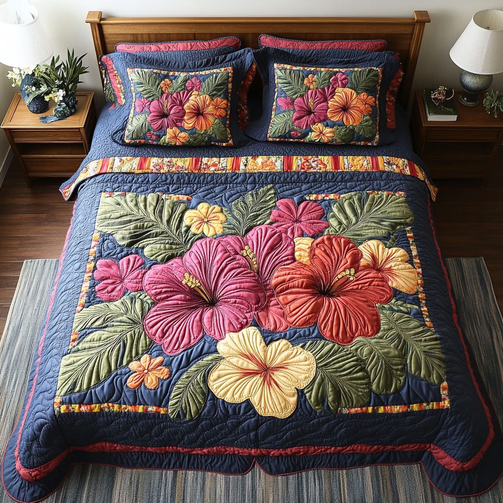 Hibiscus Oasis quilted 3-piece bedding set on a made bed with two matching pillow shams