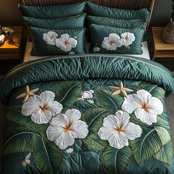 Hibiscus Paradise quilted 3-piece bedding set on a made bed with two matching pillow shams