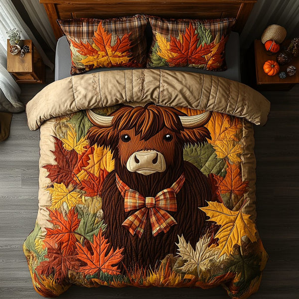 Highland Cow Meadow quilted 3-piece bedding set on a made bed with two matching pillow shams