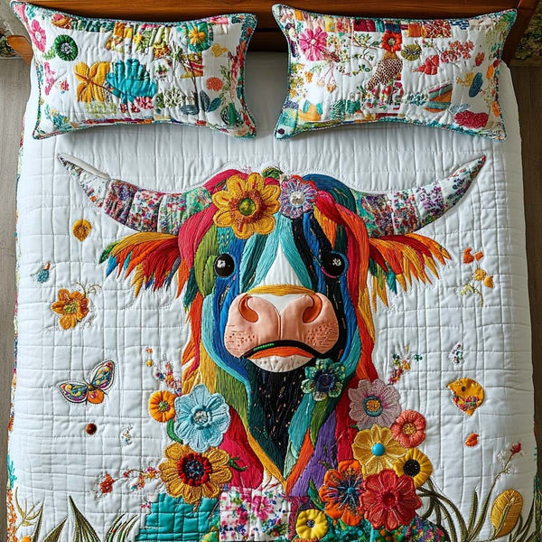 Highland Heartbeat quilted 3-piece bedding set on a made bed with two matching pillow shams