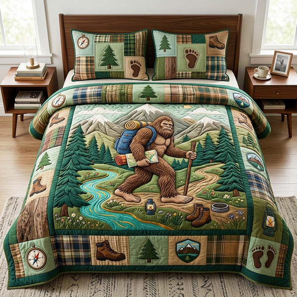 Hiking Bigfoot quilted 3-piece bedding set on a made bed with two matching pillow shams