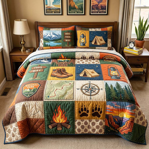 Hiking Camp quilted 3-piece bedding set on a made bed with two matching pillow shams