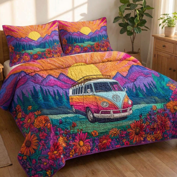 Hippie Sunset quilted 3-piece bedding set on a made bed with two matching pillow shams