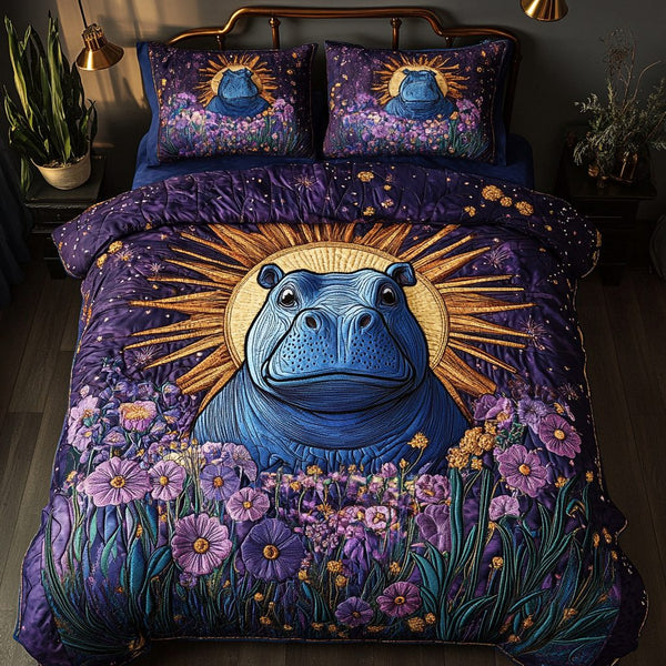 Hippo Haven quilted 3-piece bedding set on a made bed with two matching pillow shams
