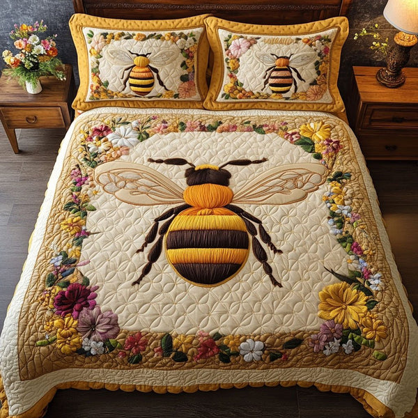 Hive Keeper quilted 3-piece bedding set on a made bed with two matching pillow shams