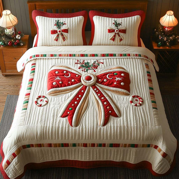 Holiday Bow Delight quilted 3-piece bedding set on a made bed in a winter-styled bedroom