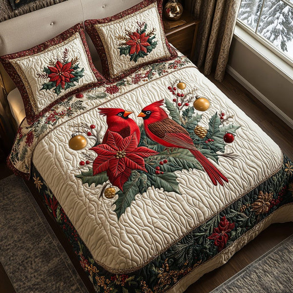 Holly Cardinals quilted 3-piece bedding set on a made bed with two matching pillow shams