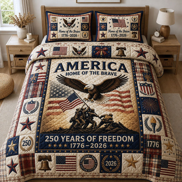 Home Of The Brave quilted 3-piece bedding set on a made bed with two matching pillow shams