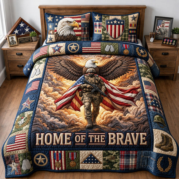 Home Of The Brave quilted 3-piece bedding set on a made bed with two matching pillow shams