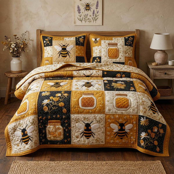 Honey Jar quilted 3-piece bedding set on a made bed with two matching pillow shams